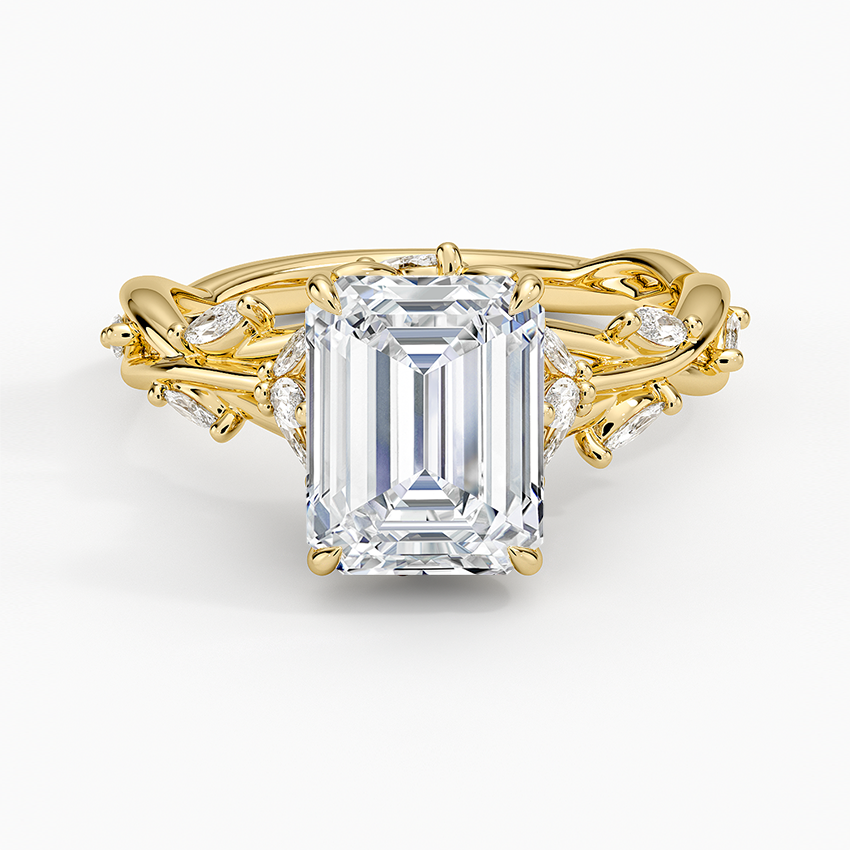 Emerald cut lab grown diamond ring in yellow gold with marquise leaf accents on a twisted vine band, top view