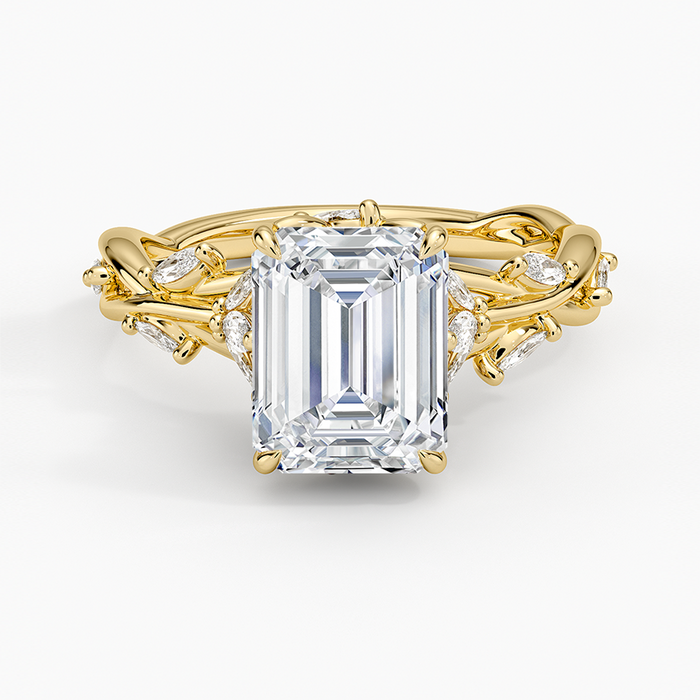 Emerald cut lab grown diamond ring in yellow gold with marquise leaf accents on a twisted vine band, top view