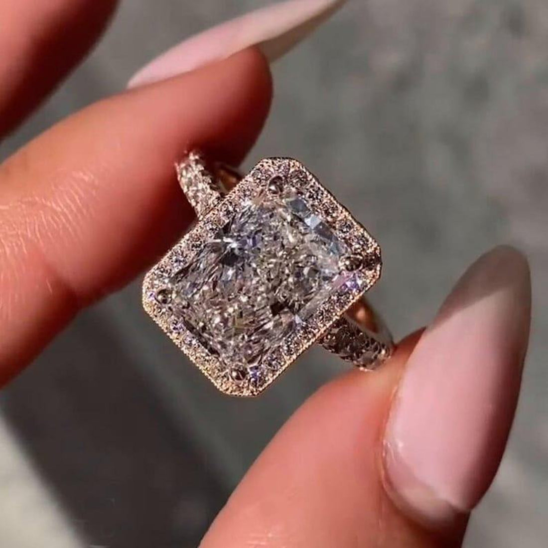 Radiant cut lab grown diamond cathedral halo engagement ring with pave band