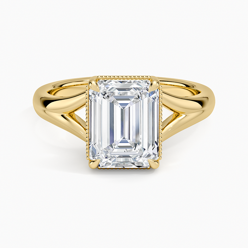 Emerald cut lab grown diamond ring in yellow gold with a milgrain edged collar and split shank, top view