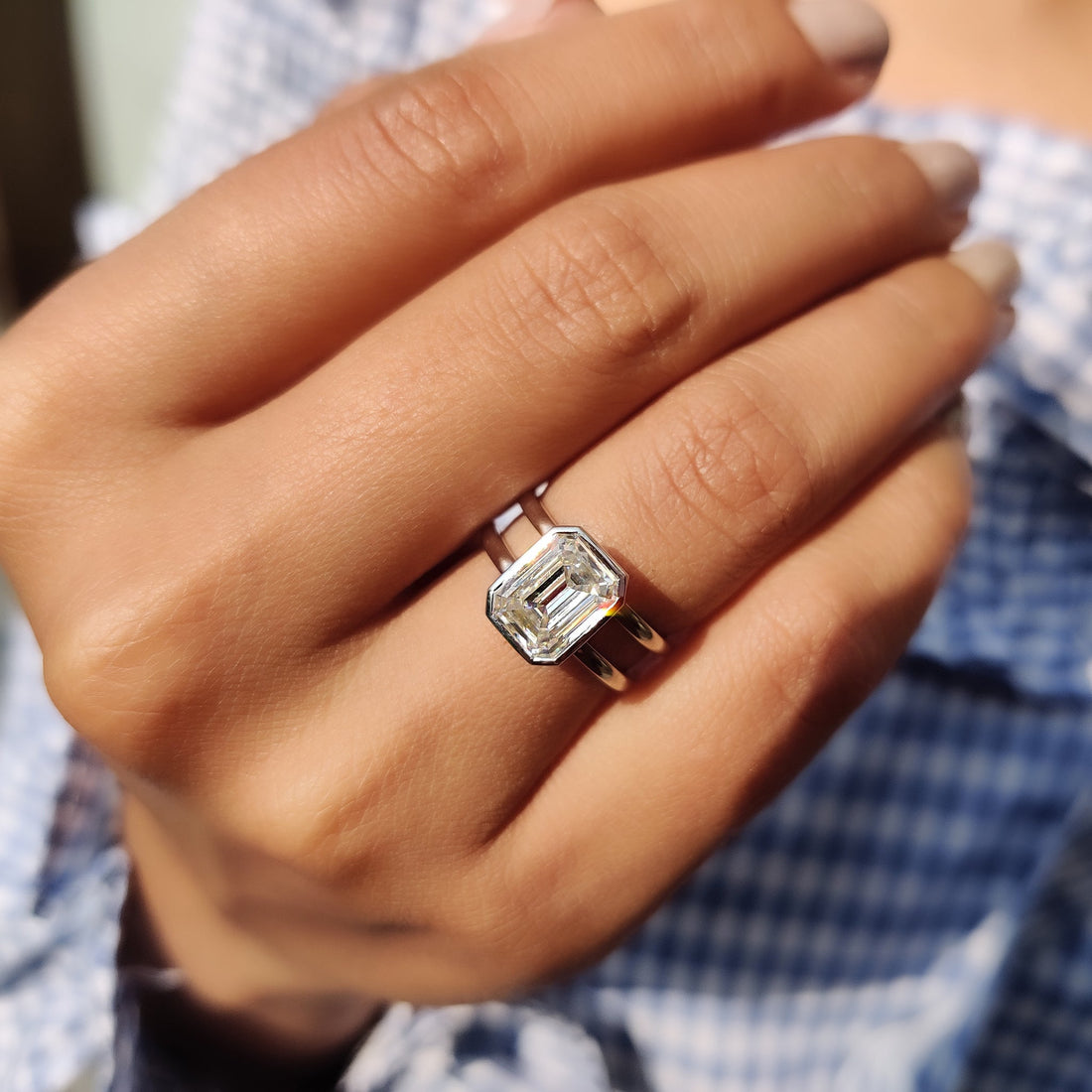 Emerald cut lab grown diamond double shank solitaire ring
