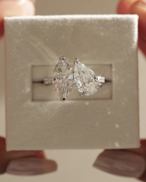 Pear and marquise cut five claw toi et moi engagement ring