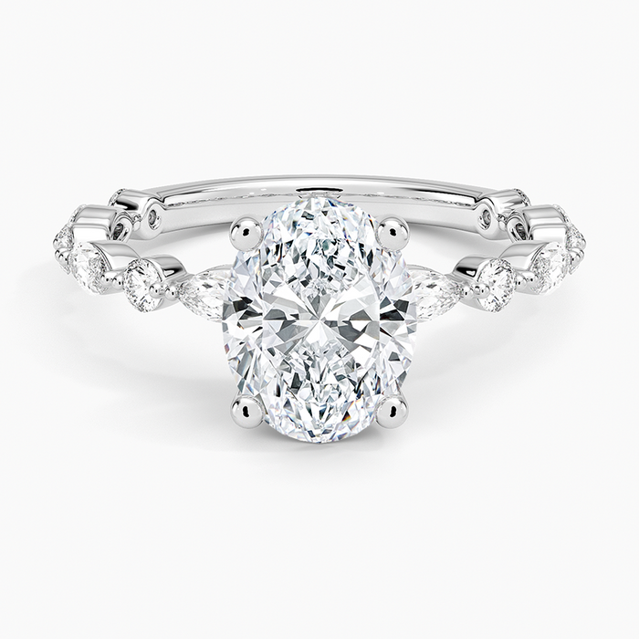 Oval cut lab grown diamond ring on a marquise and round eternity band in white gold, top view