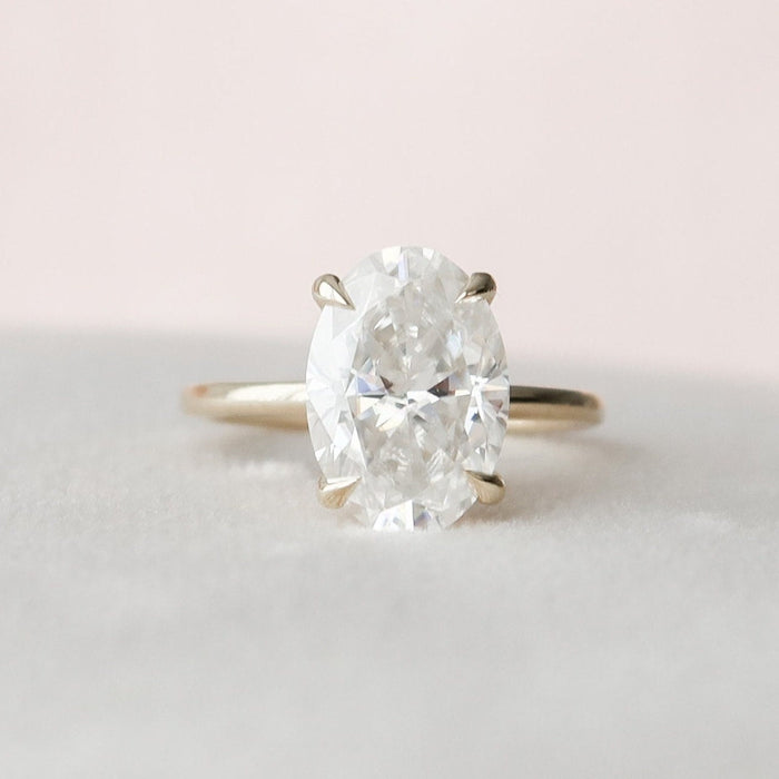 Oval lab grown diamond engagement ring four claw setting