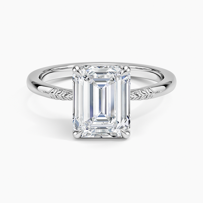 Emerald cut lab grown diamond ring with hand engraved leaf shoulders in white gold, top view