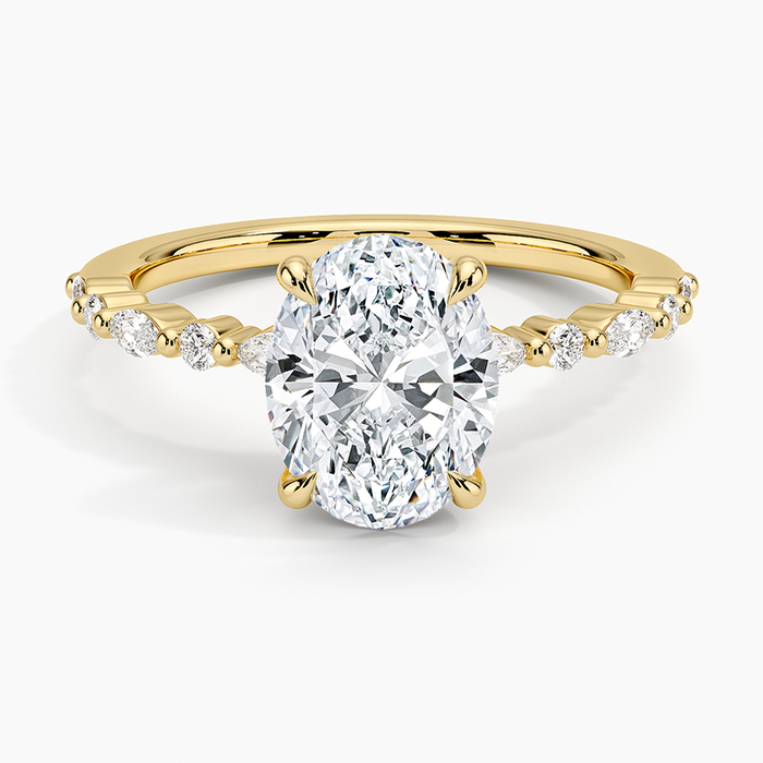 Oval cut lab grown diamond four claw ring with alternating marquise shoulders in yellow gold, top view