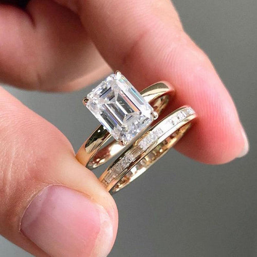 Emerald cut lab grown diamond bridal ring set with channel set band