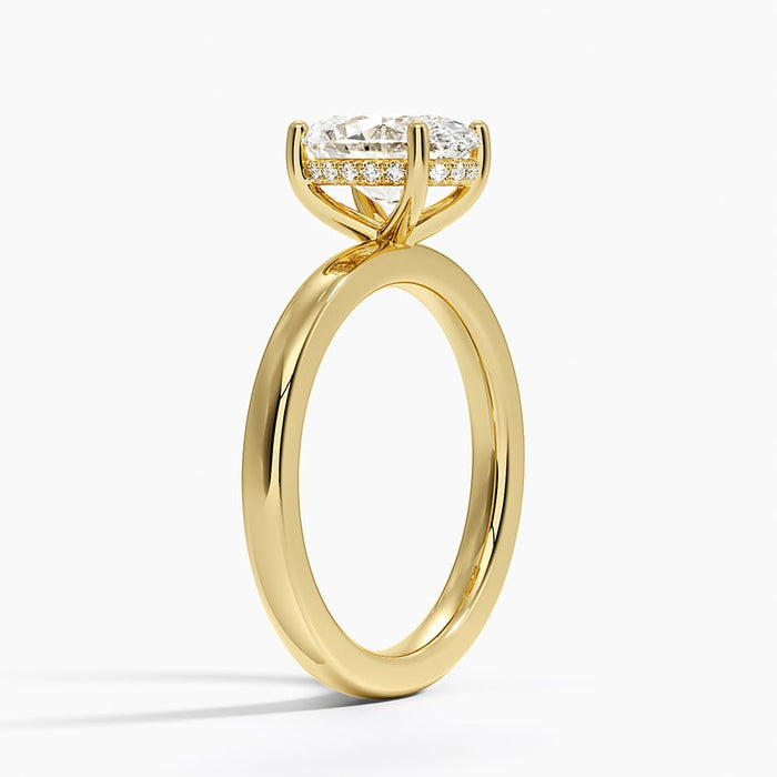 Profile view showing the pave hidden halo around the tall collar and the open four leg gallery