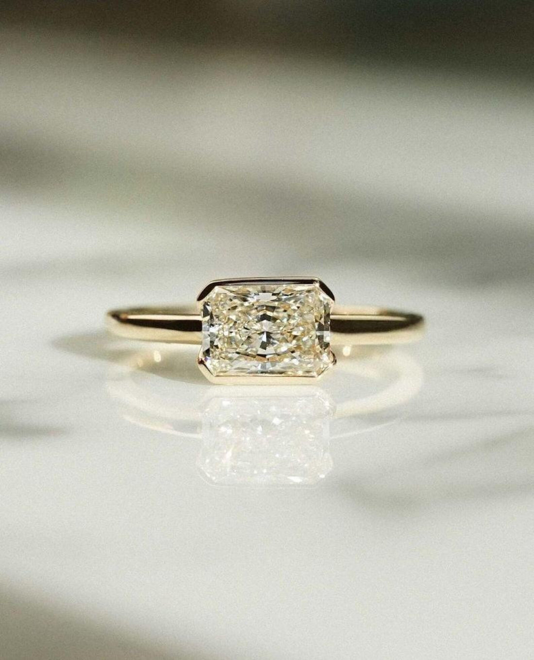 East west radiant cut lab grown diamond half bezel engagement ring