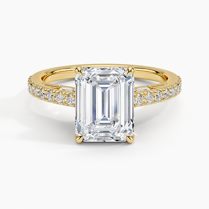 Emerald cut lab grown diamond ring with slim pave band in yellow gold, top view