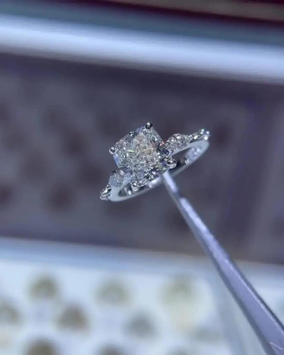 Cushion cut lab grown diamond engagement ring with marquise distance pave band