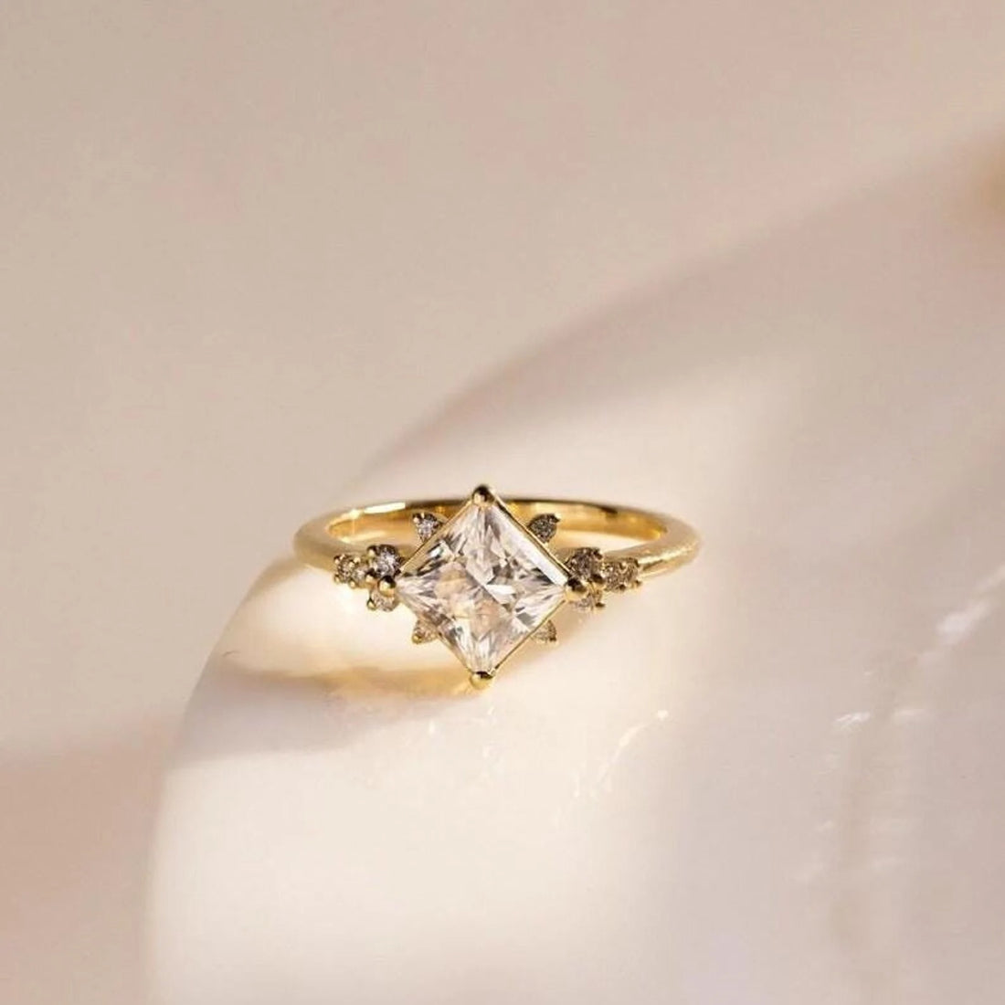 Kite set princess cut lab grown diamond engagement ring with scattered accents in yellow gold