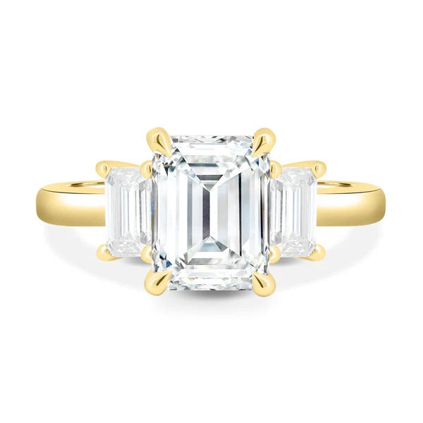 Emerald cut three stone engagement ring detail