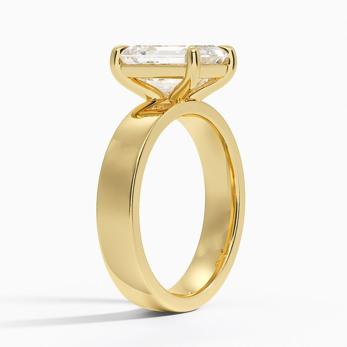 Profile view showing the full width band and low set head of the emerald cut lab grown diamond ring
