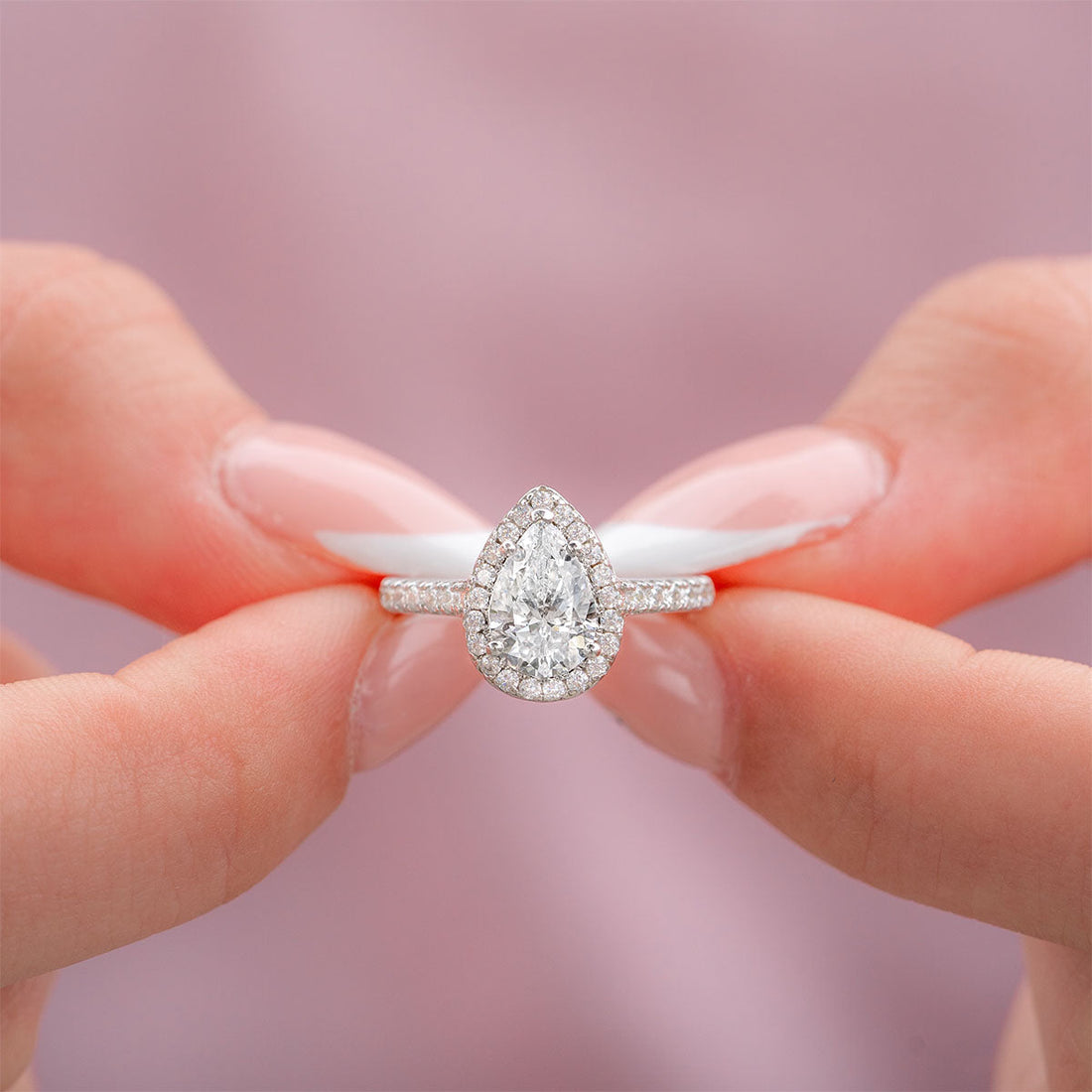 Pear lab grown diamond teardrop halo engagement ring with pave band