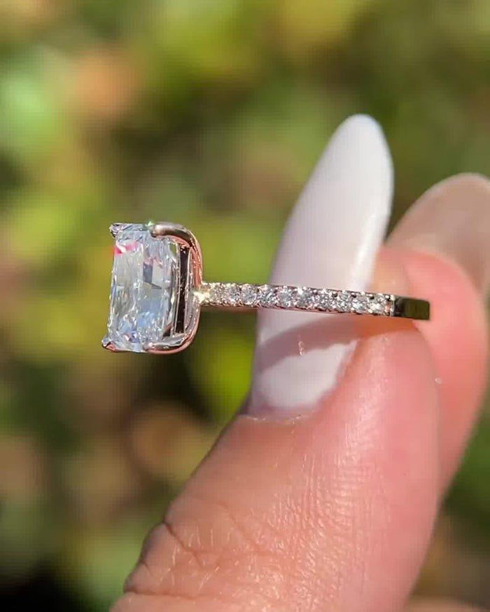 Radiant cut lab grown diamond solitaire ring with pave band