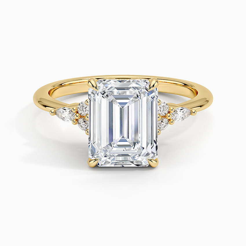Emerald cut lab grown diamond ring in yellow gold with marquise and round accent clusters on each shoulder, top view