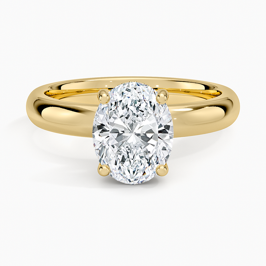 Oval cut lab grown diamond ring with a hidden halo on a tapered domed band in yellow gold, top view
