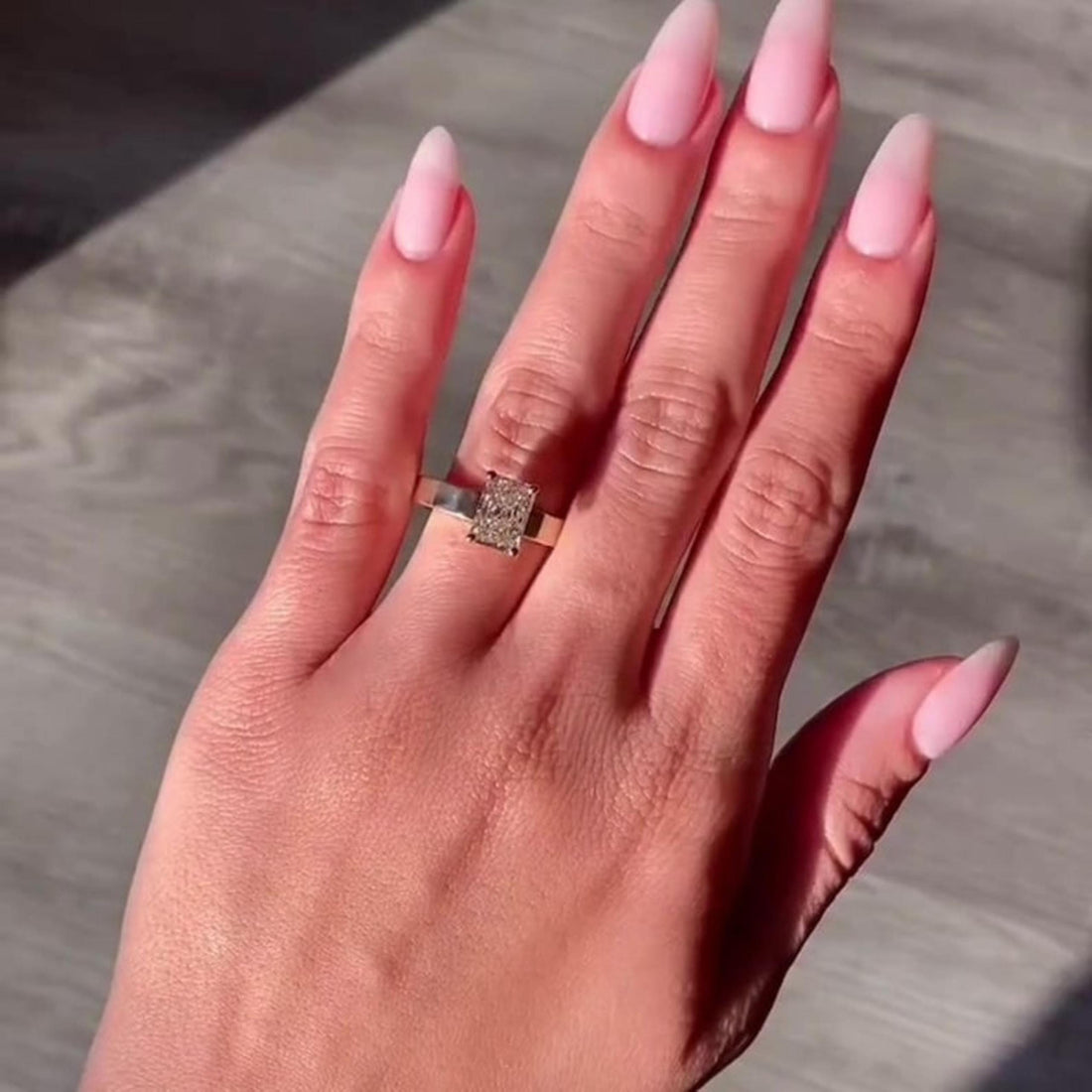Radiant cut lab grown diamond solitaire engagement ring on a wide 3mm yellow gold band