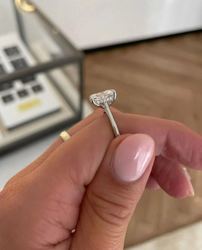 Elongated cushion cut lab grown diamond ring shown on the hand