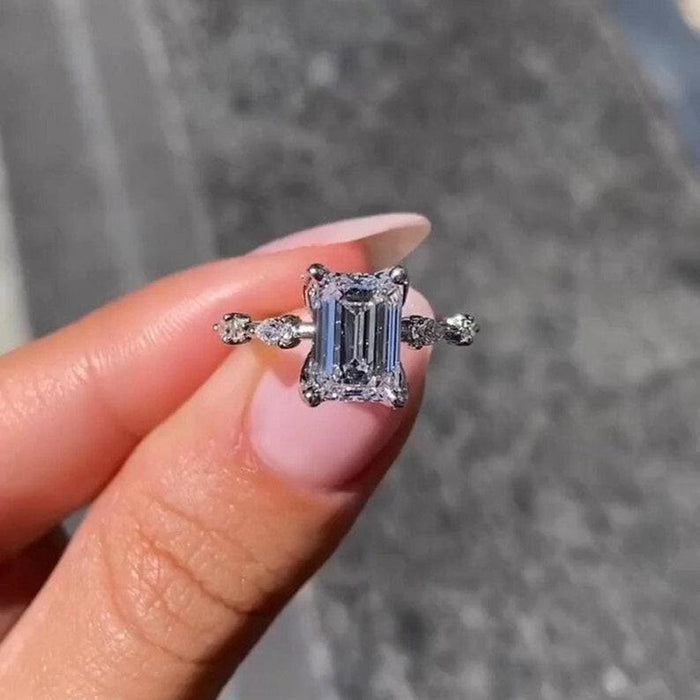 Emerald cut lab grown diamond distance pave ring angled view