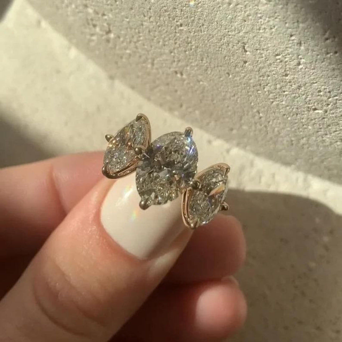 Oval cut lab grown diamond three stone trilogy ring