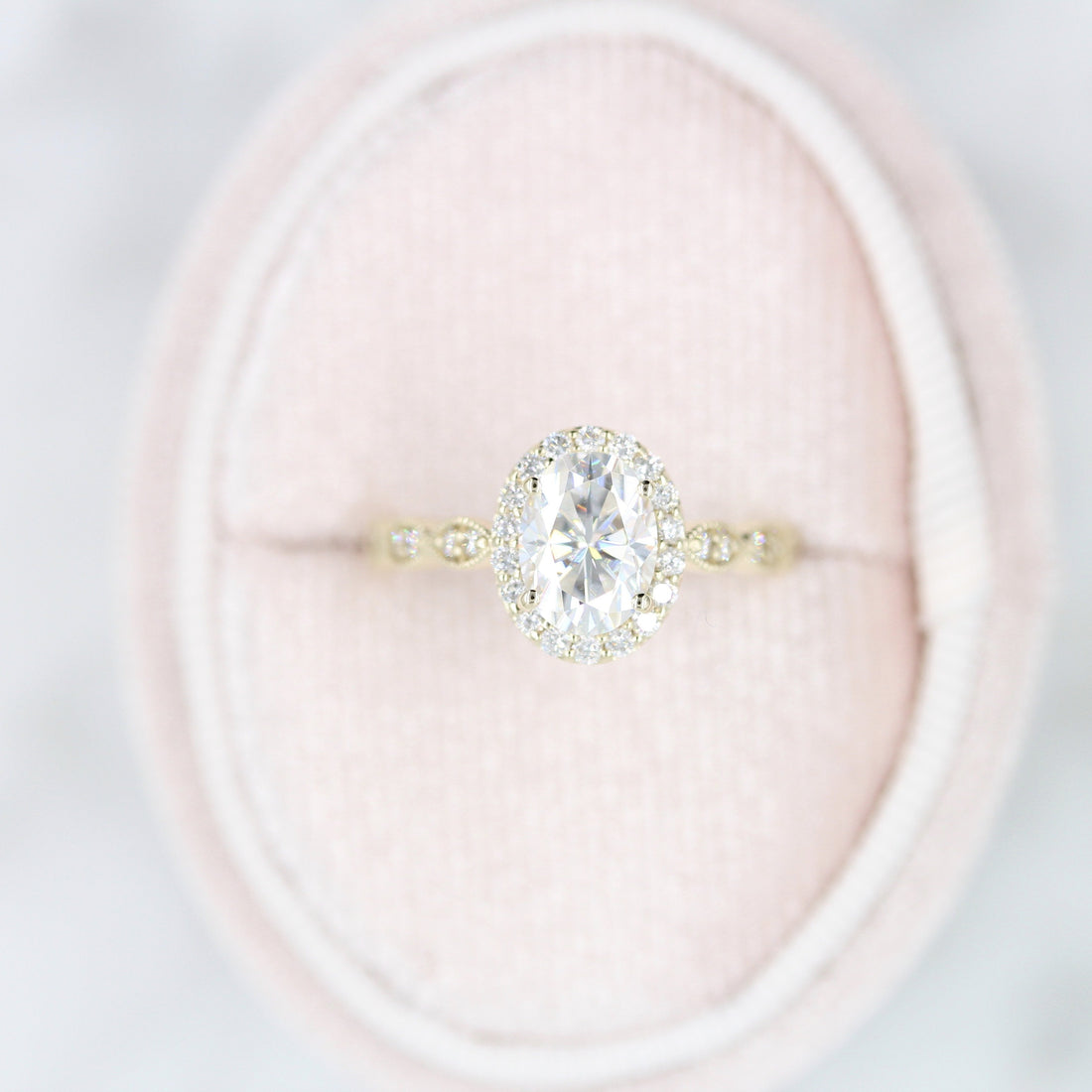 Oval lab grown diamond halo ring with marquise motif band