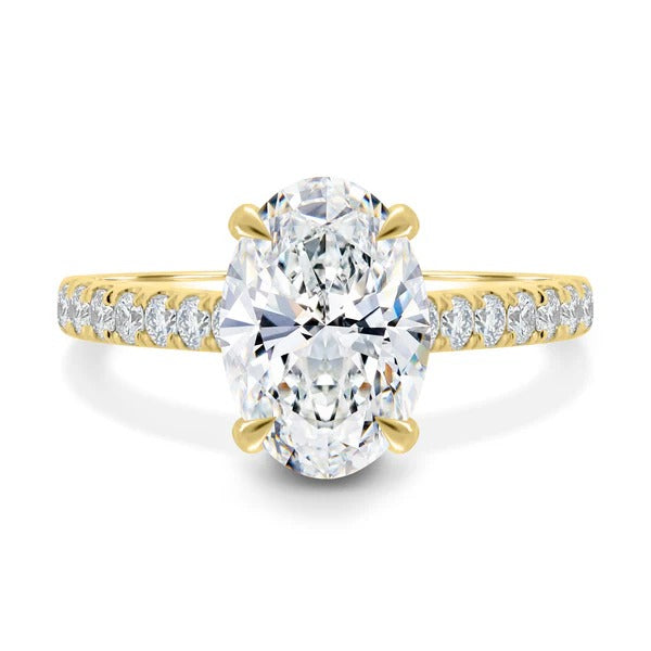 Oval cut diamond solitaire ring with hidden halo and pave band