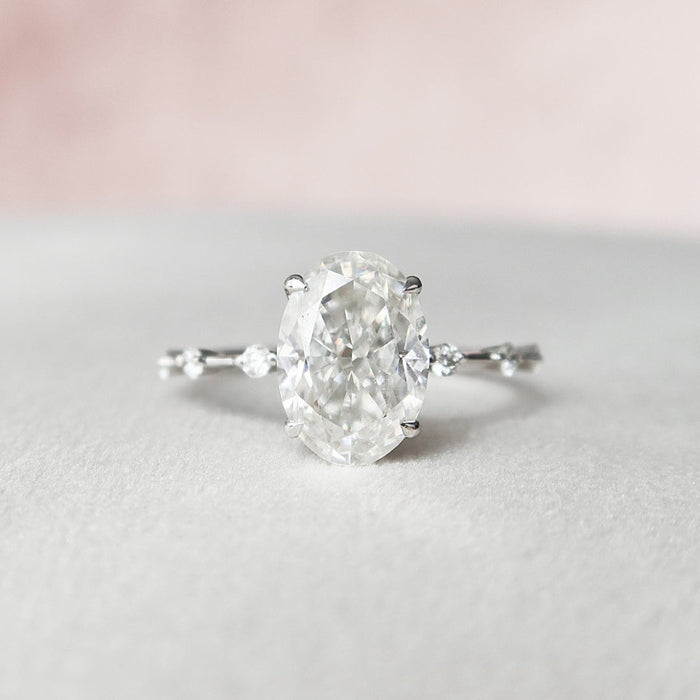 Oval cut lab grown diamond ring on a scattered diamond station band