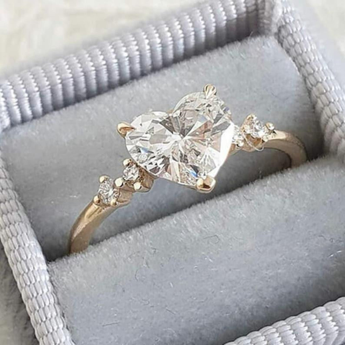 Heart cut lab grown diamond engagement ring with round side stones