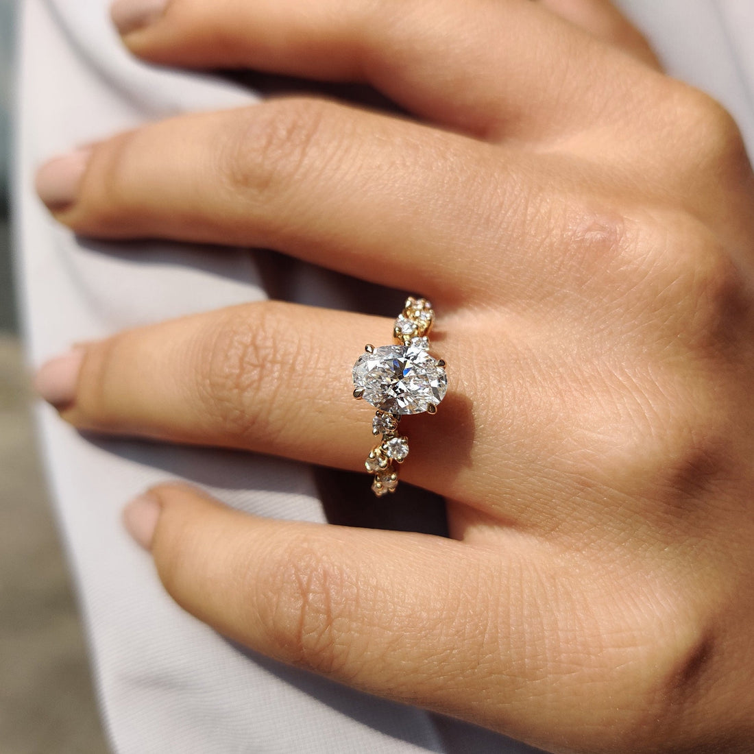 Oval lab grown diamond scattered accent engagement ring
