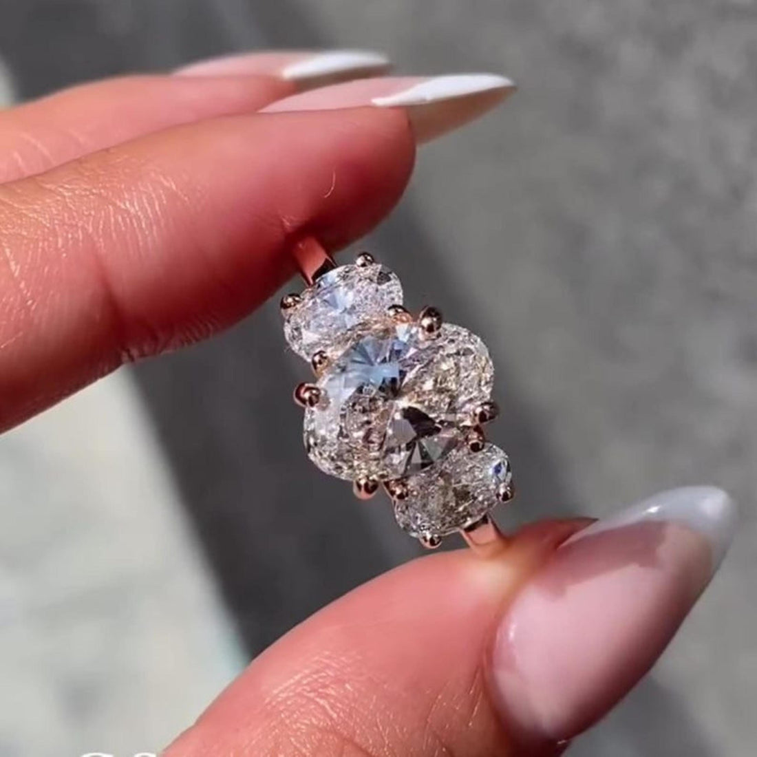 Yellow gold oval trilogy lab grown diamond ring top view