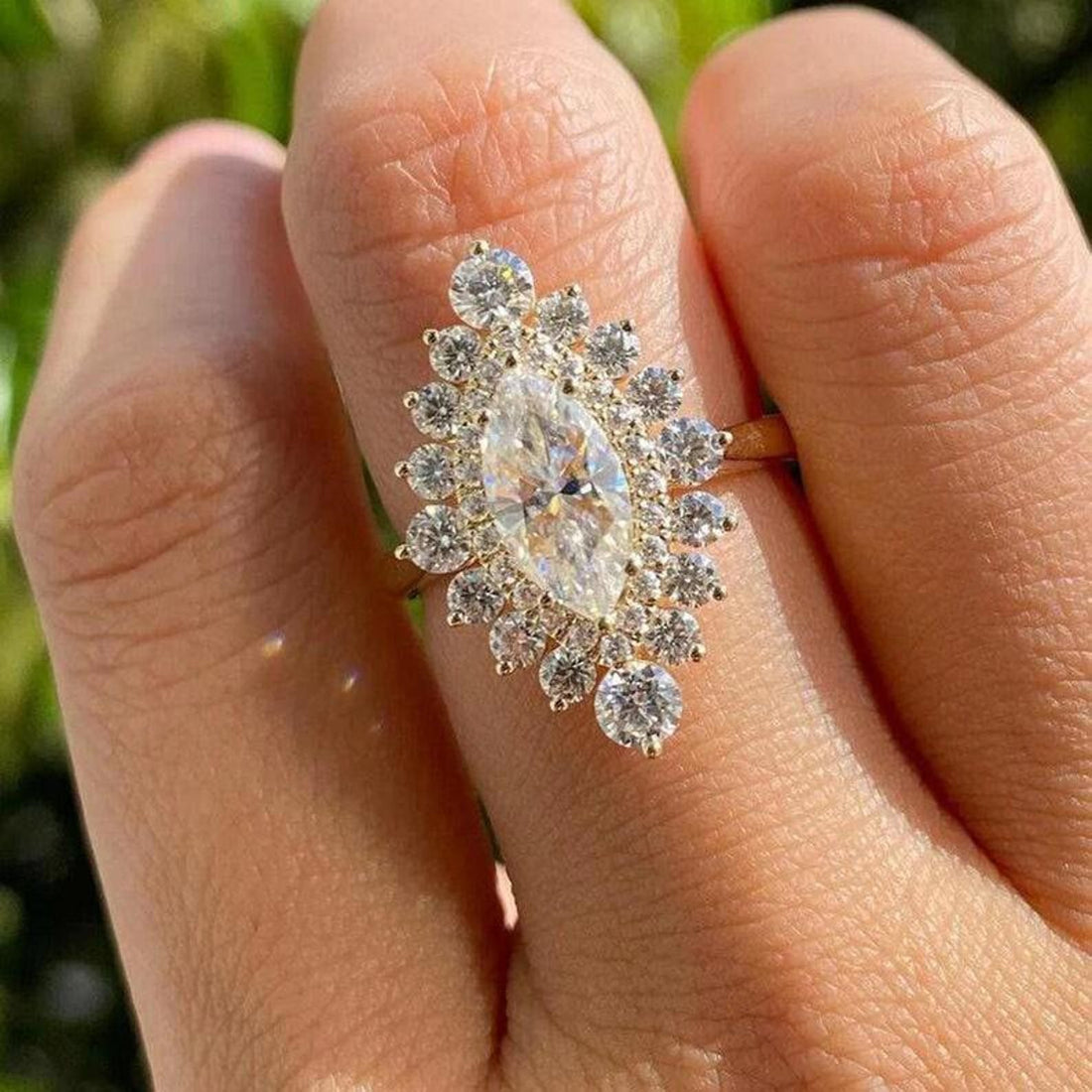 Marquise cut lab grown diamond engagement ring with starburst halo cluster