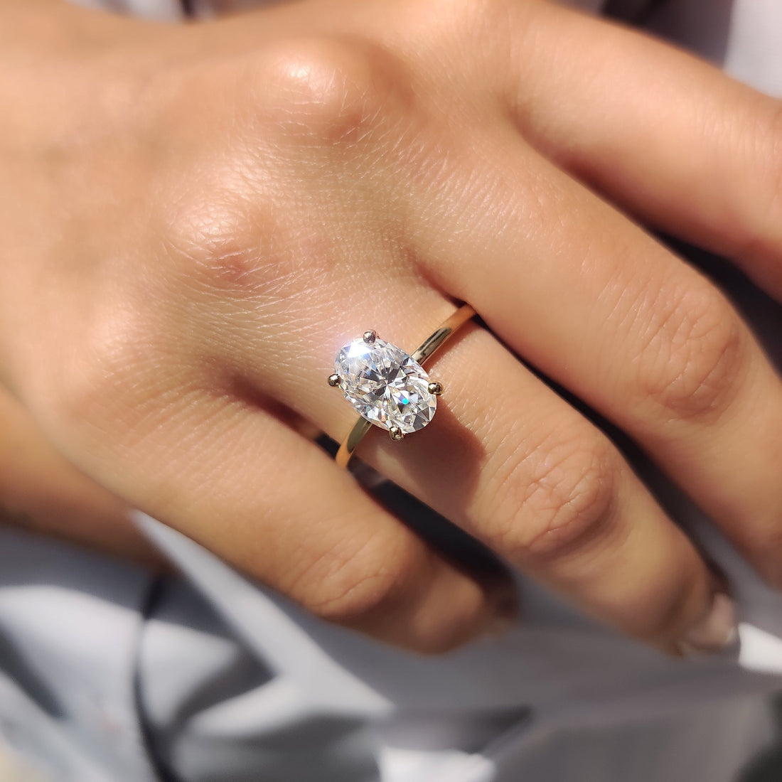 Oval cut lab grown diamond hidden halo engagement ring
