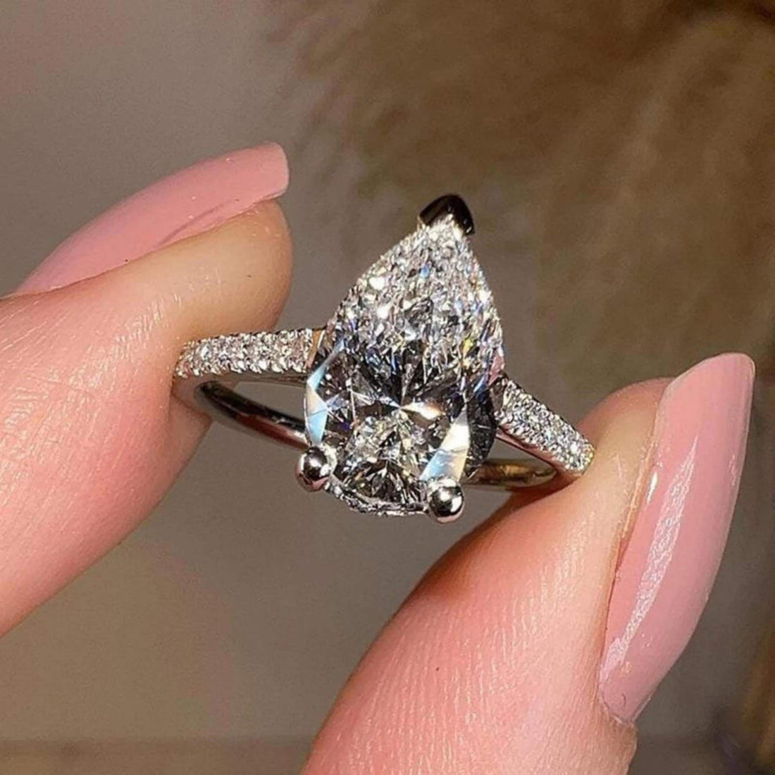 Pear cut lab grown diamond ring side profile