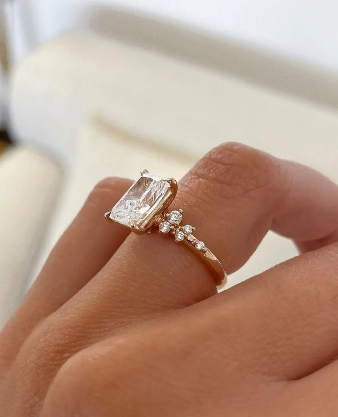 Radiant cut lab grown diamond engagement ring with asymmetric cluster accents in yellow gold