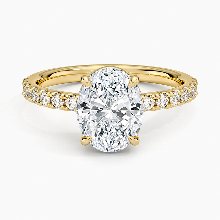 Oval cut lab grown diamond ring with half coverage pave in yellow gold, top view