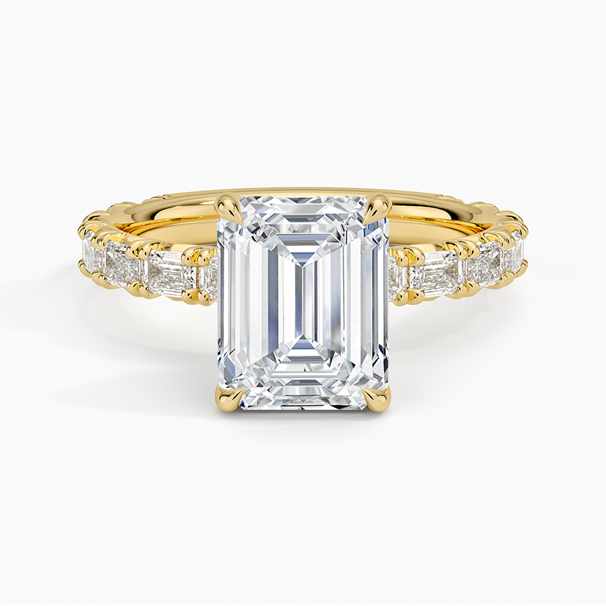 Emerald cut lab grown diamond ring with baguette diamond eternity band in yellow gold, top view