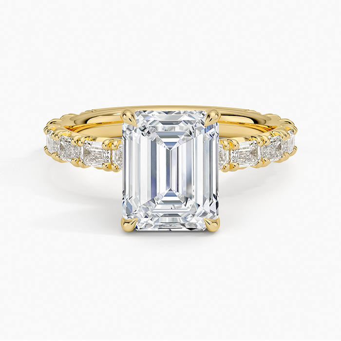 Emerald cut lab grown diamond ring with baguette diamond eternity band in yellow gold, top view