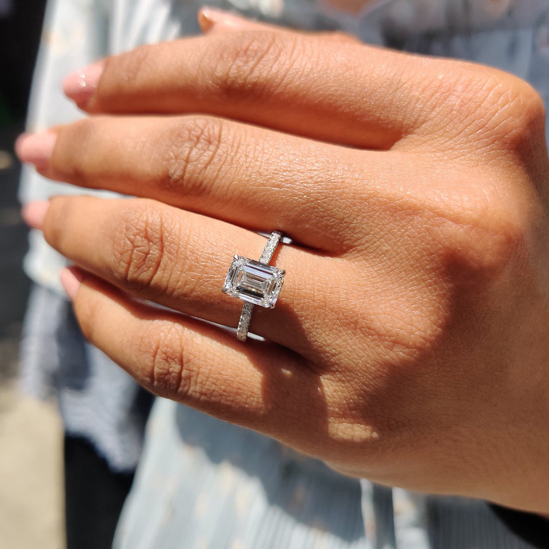 Emerald cut lab grown diamond hidden halo and pave engagement ring