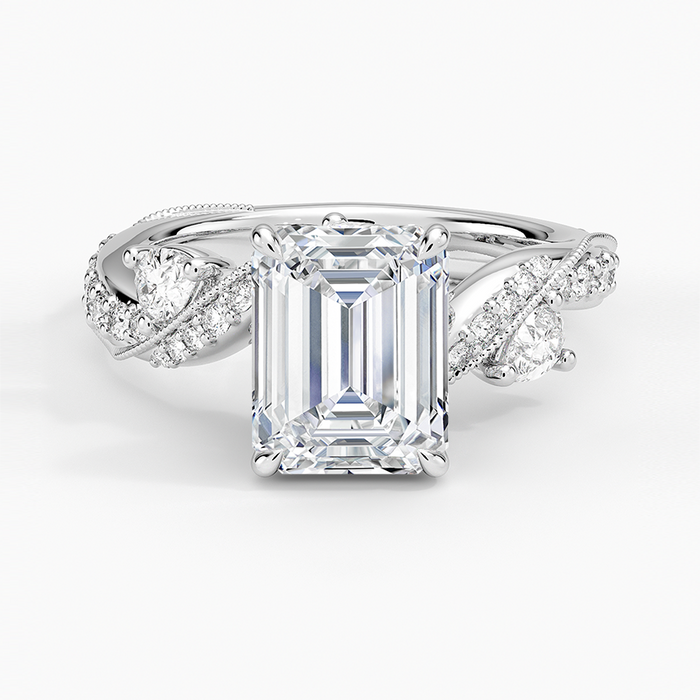 Emerald cut lab grown diamond ring in white gold with round accent buds on a pave vine band, top view