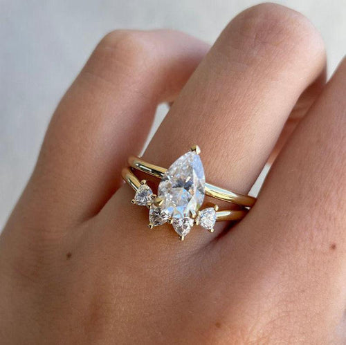 Pear cut lab grown diamond bridal ring set with trilliant side stones