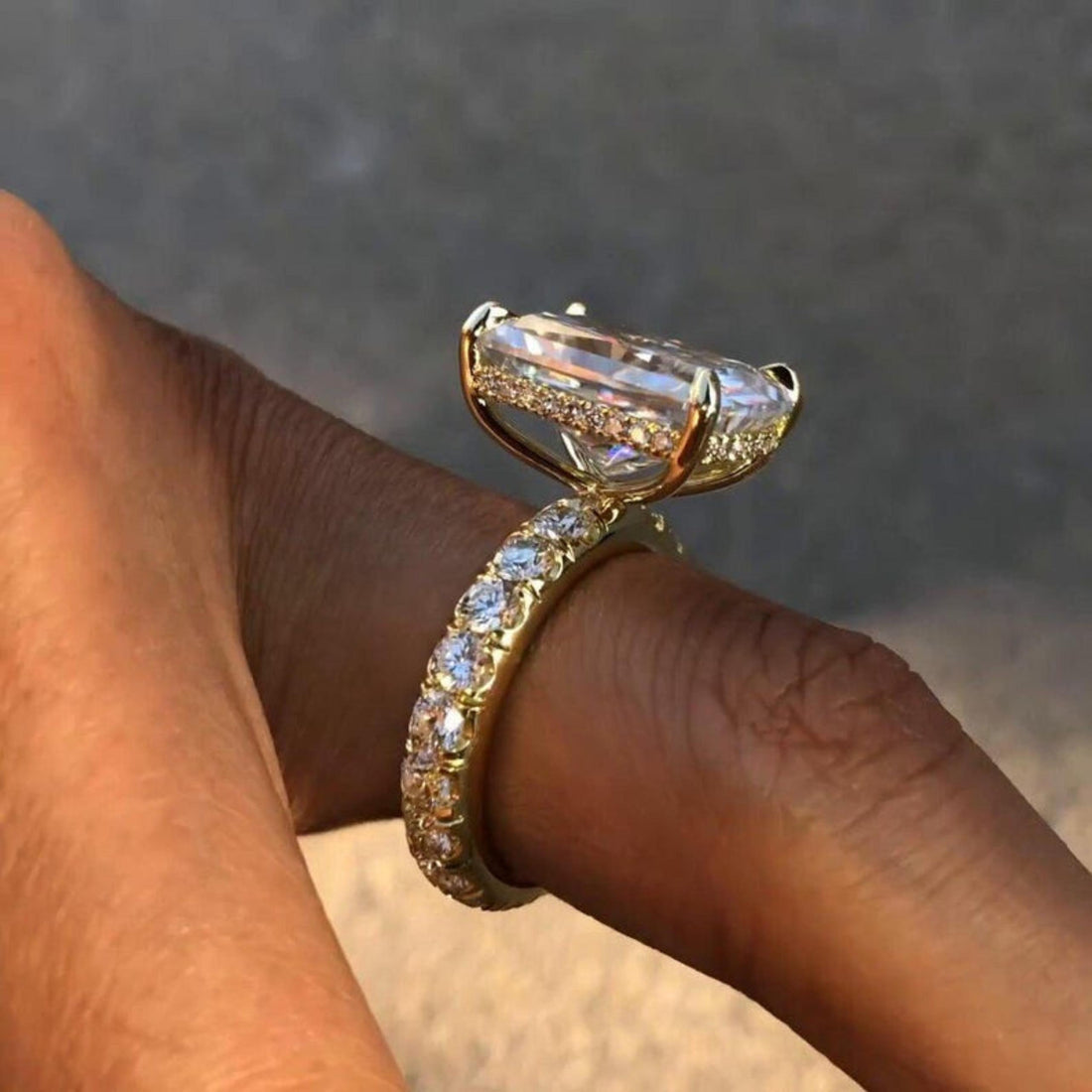 Radiant cut lab grown diamond engagement ring with hidden halo and pave eternity band
