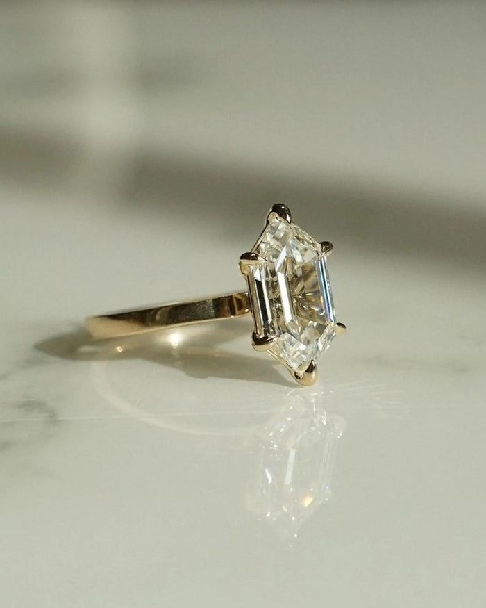 Hexagon step cut lab grown diamond on a plain slim band