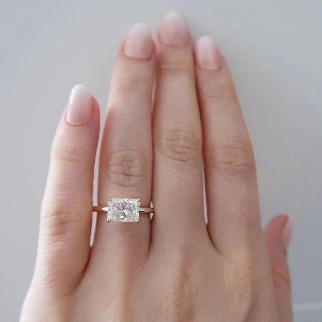 East west radiant cut lab grown diamond four prong ring