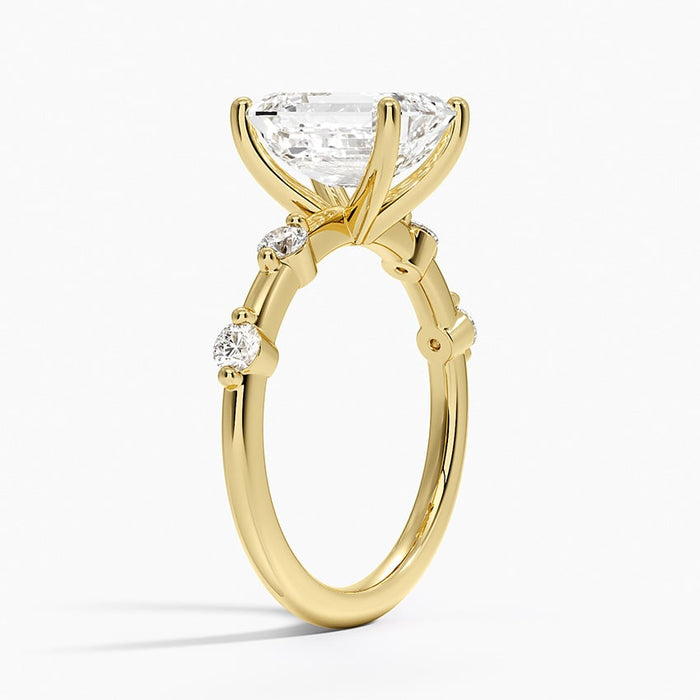 Profile view showing the spaced round accents claw set with polished metal between them