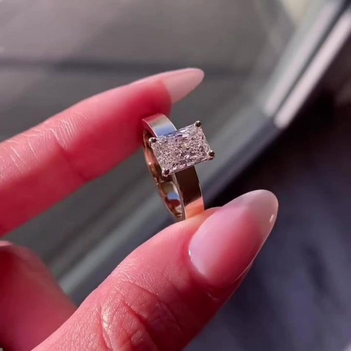 Wide flat 3mm band supporting the radiant cut lab grown diamond