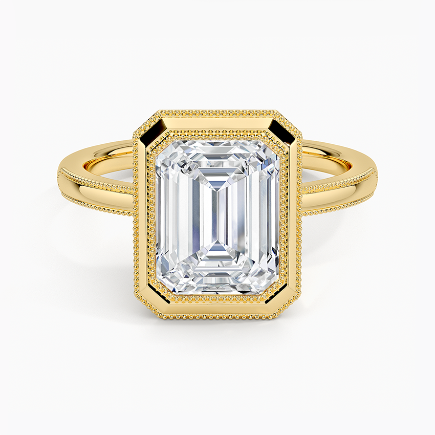 Emerald cut lab grown diamond ring in a milgrain edged yellow gold bezel, top view
