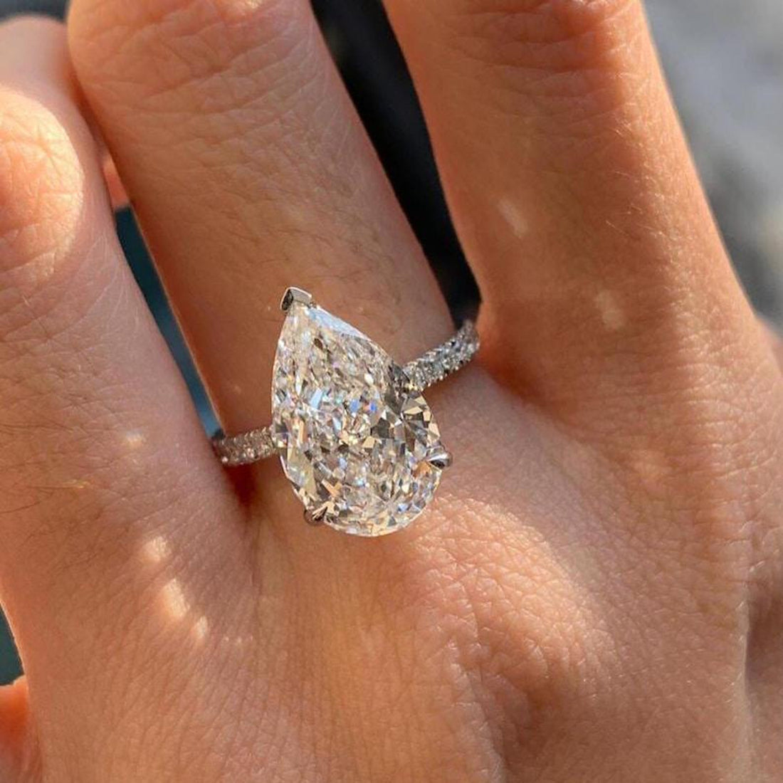 Pear cut lab grown diamond hidden halo engagement ring in white gold