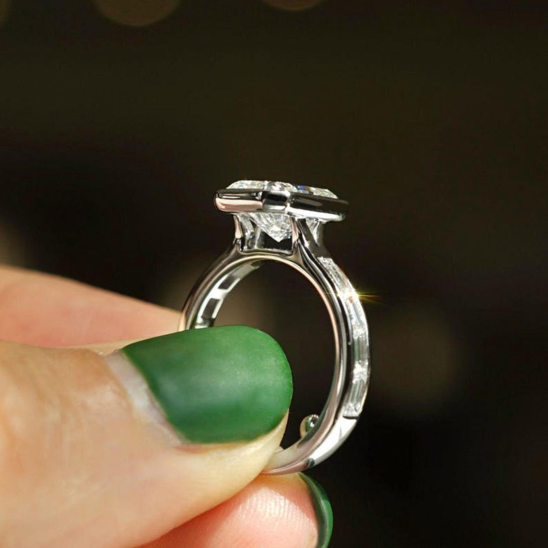 Radiant cut lab grown diamond bezel ring with channel set baguettes